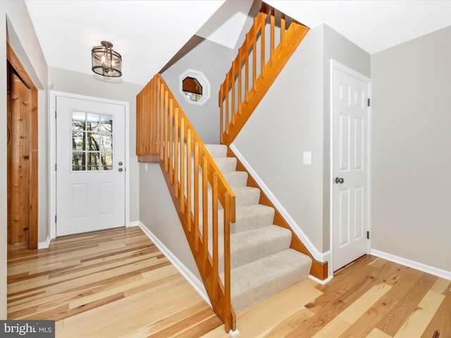 7407 Woodville, Mount Airy, MD 21771 - foyer featuring baseboards, an inviting chandelier, stairs, and light wood-style floors