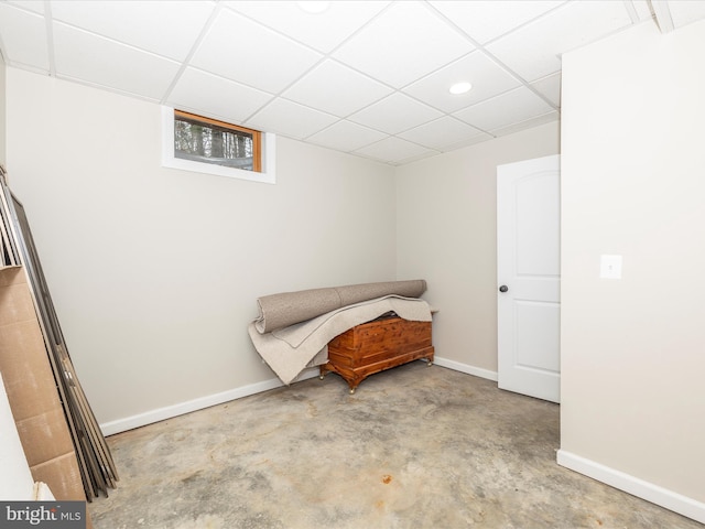 living area with a paneled ceiling