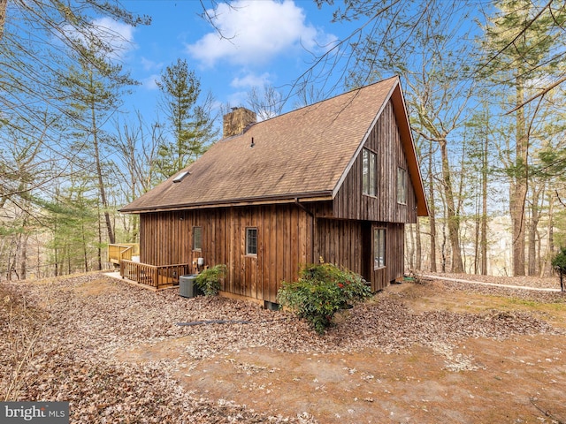 view of property exterior with central AC