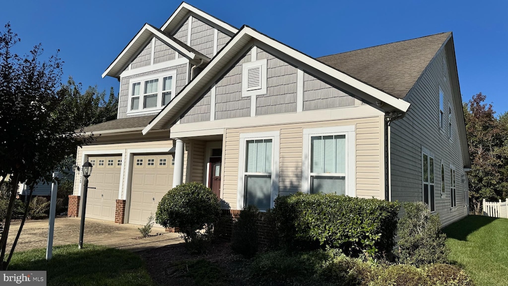 craftsman house with a garage