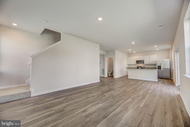 unfurnished living room with light hardwood / wood-style floors