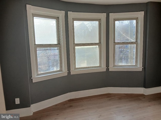 spare room with light wood-type flooring