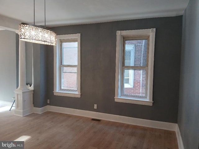 unfurnished dining area with hardwood / wood-style floors