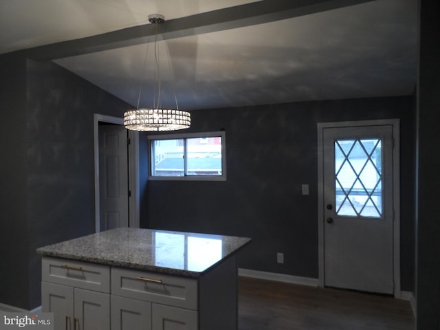 kitchen with pendant lighting, hardwood / wood-style flooring, white cabinetry, and a wealth of natural light