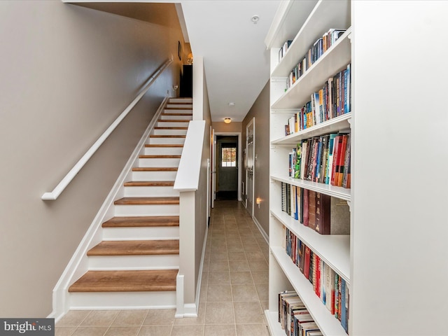 stairs with tile patterned flooring