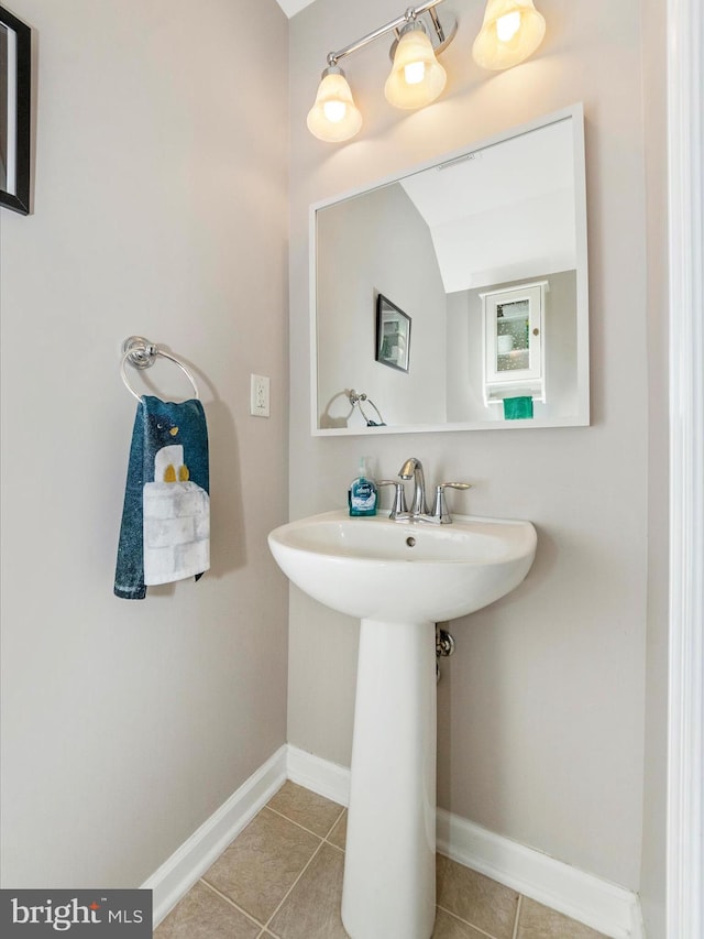 bathroom with tile patterned floors