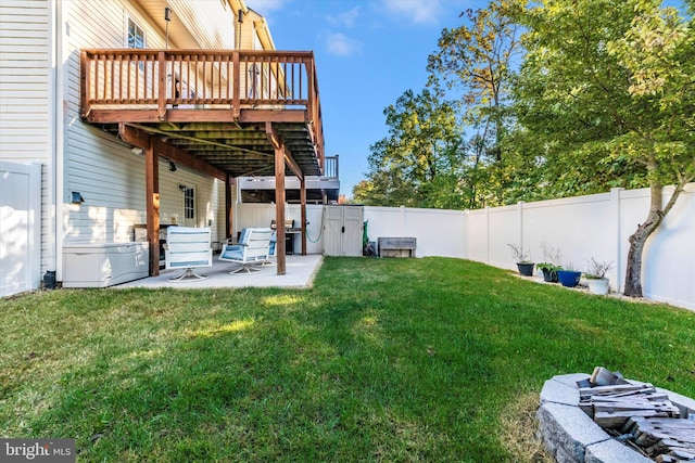 view of yard featuring a patio and a deck