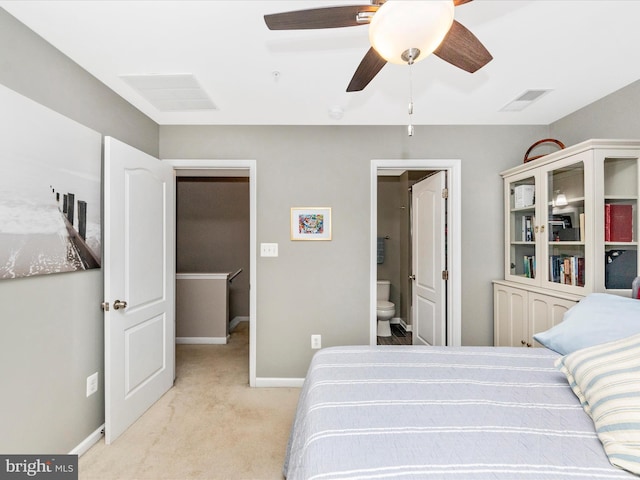 carpeted bedroom featuring connected bathroom and ceiling fan