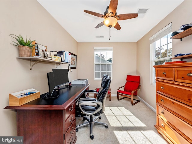 office space with light carpet and ceiling fan