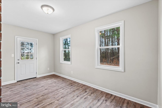 spare room with light wood-type flooring