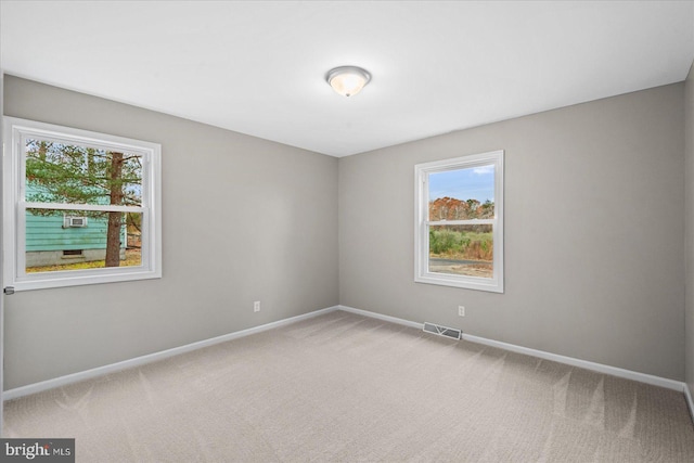 empty room featuring carpet flooring