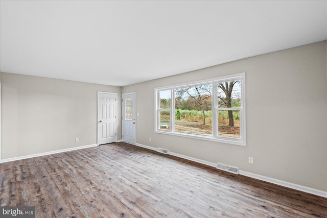 empty room featuring hardwood / wood-style floors