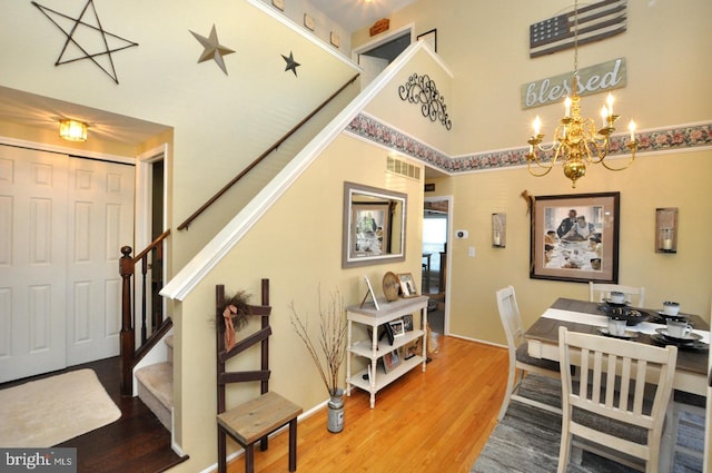 dining room with a chandelier and hardwood / wood-style floors