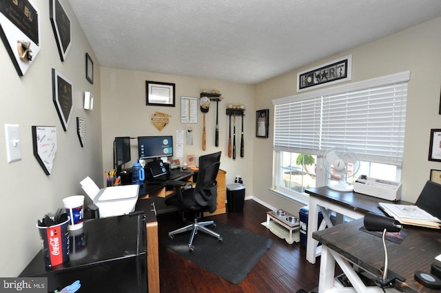 home office with a textured ceiling and wood-type flooring