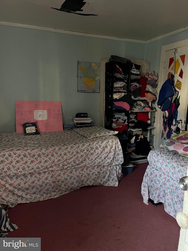 carpeted bedroom featuring crown molding