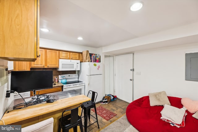 kitchen featuring decorative backsplash, white appliances, and electric panel