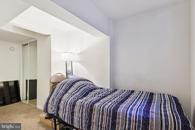 bedroom with light colored carpet