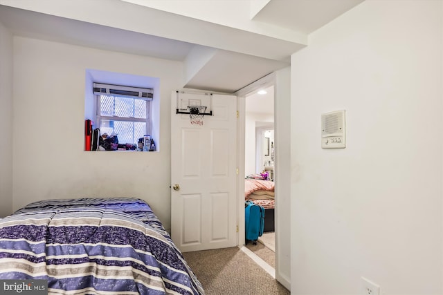 bedroom featuring light carpet