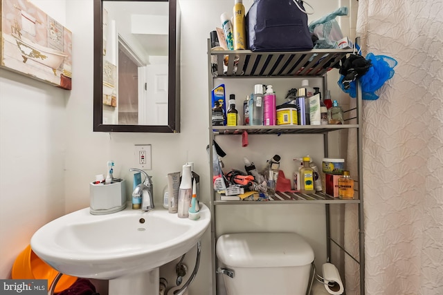 bathroom with toilet and sink