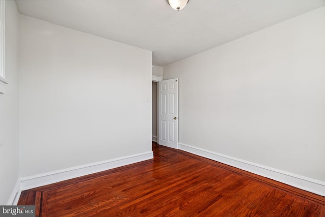 unfurnished room featuring wood-type flooring