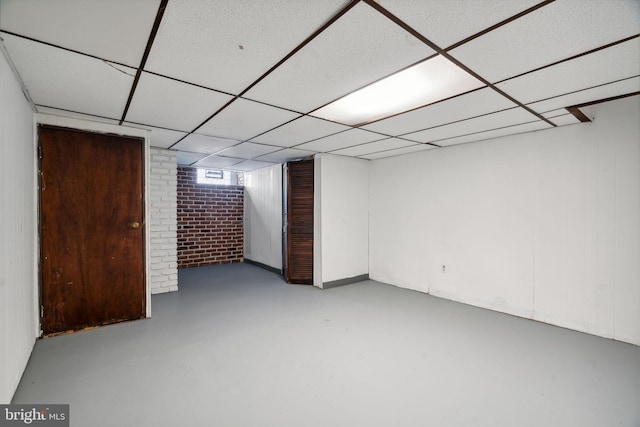 basement featuring a drop ceiling