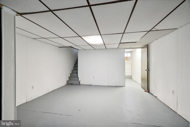 basement featuring a drop ceiling