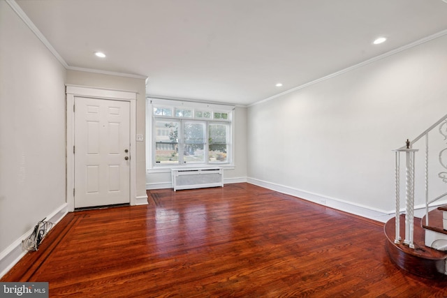 interior space with an AC wall unit, crown molding, and dark hardwood / wood-style floors