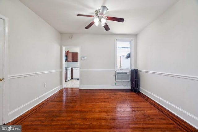 unfurnished room with ceiling fan and hardwood / wood-style flooring