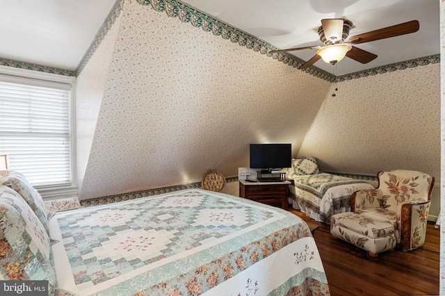 bedroom featuring lofted ceiling, ceiling fan, and dark hardwood / wood-style flooring