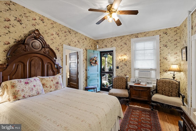 bedroom featuring ornamental molding, cooling unit, hardwood / wood-style flooring, and ceiling fan