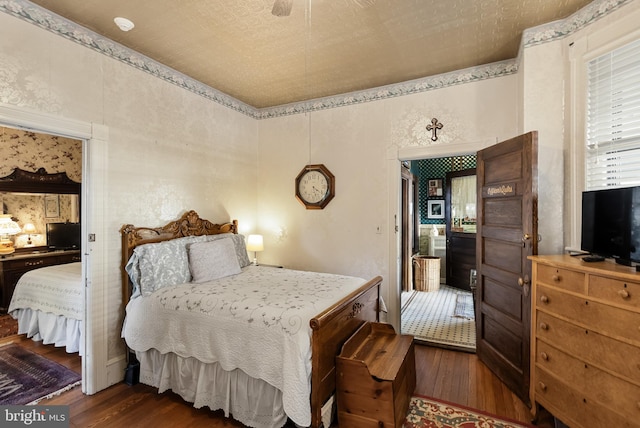 bedroom with dark wood-type flooring and ceiling fan