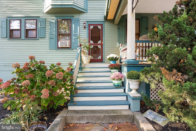 property entrance with covered porch