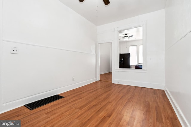 unfurnished living room featuring hardwood / wood-style floors and ceiling fan