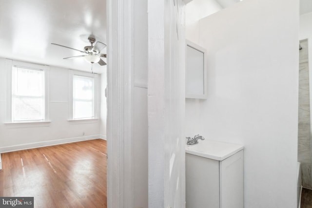 bathroom featuring hardwood / wood-style floors and ceiling fan