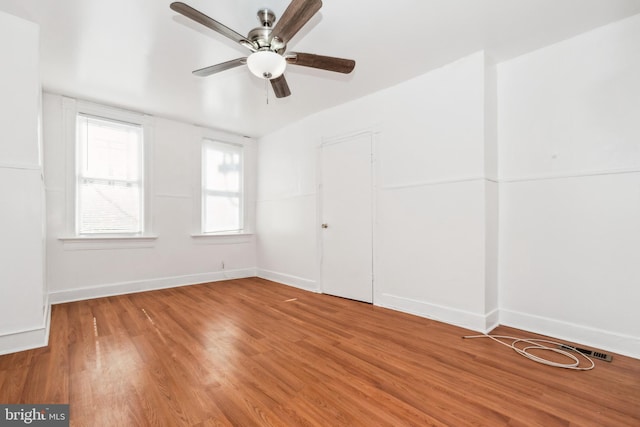 interior space featuring wood-type flooring and ceiling fan