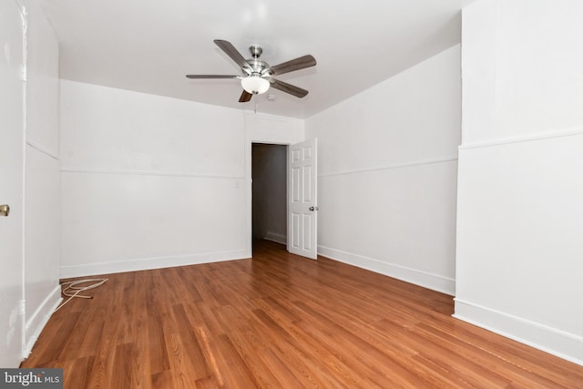 unfurnished room with hardwood / wood-style flooring and ceiling fan