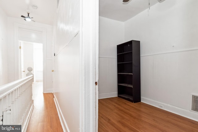 corridor featuring hardwood / wood-style floors