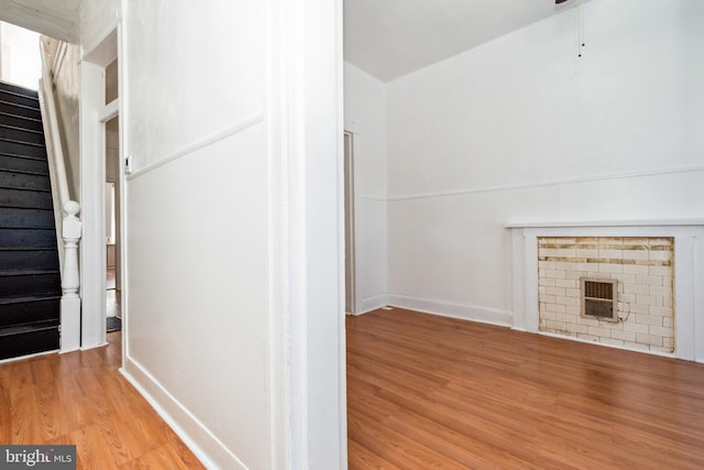 unfurnished living room with light wood-type flooring