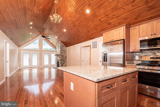 kitchen with a center island, stainless steel appliances, wooden ceiling, and ceiling fan with notable chandelier