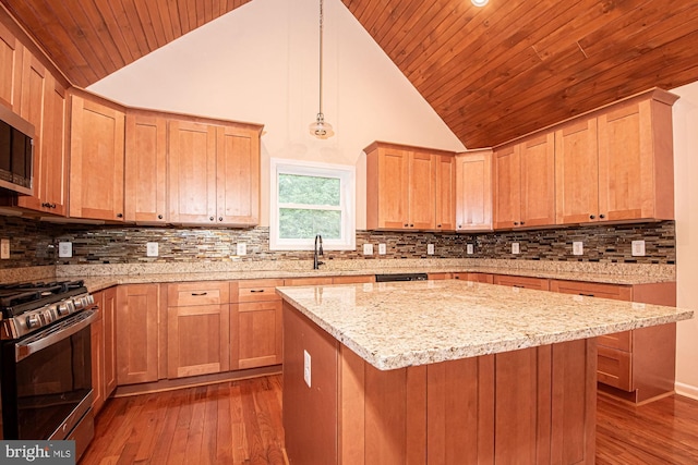 kitchen featuring light stone counters, a sink, stainless steel gas range, wood ceiling, and dark wood-style floors