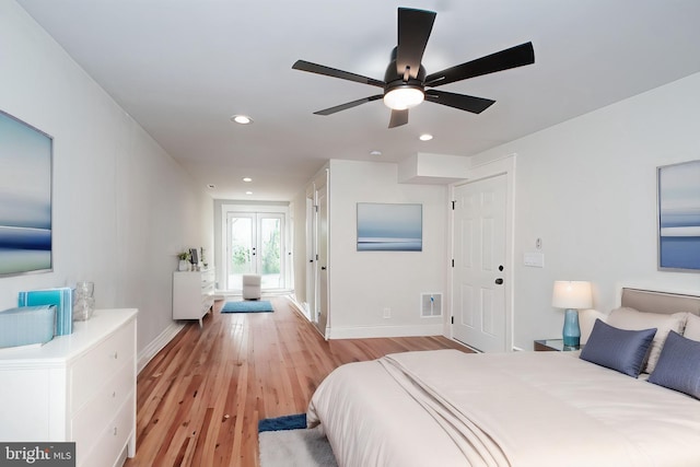 bedroom with recessed lighting, visible vents, a ceiling fan, light wood-type flooring, and baseboards