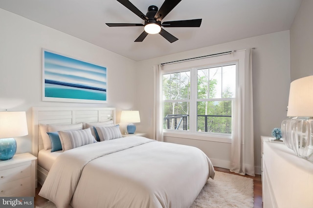 bedroom with light hardwood / wood-style flooring and ceiling fan