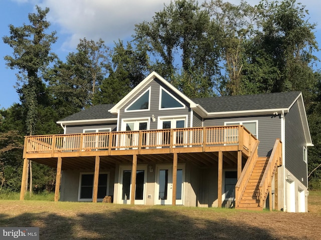 rear view of house with a wooden deck