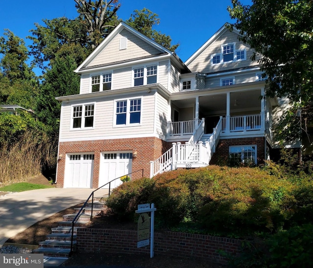 view of front of property with covered porch and a garage