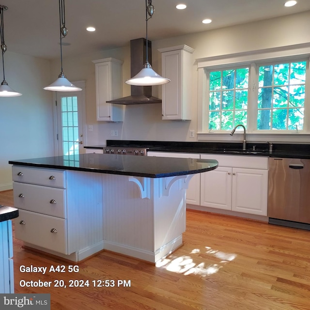 kitchen with white cabinetry, light hardwood / wood-style flooring, dishwasher, wall chimney exhaust hood, and sink