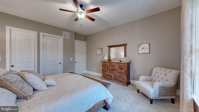 carpeted bedroom with ceiling fan