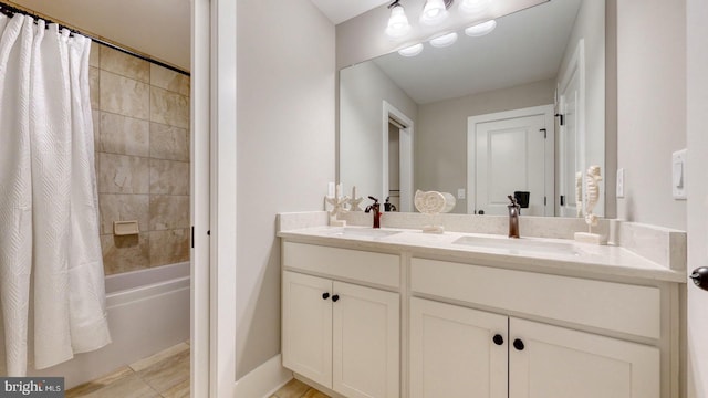 bathroom with vanity and shower / bath combo with shower curtain