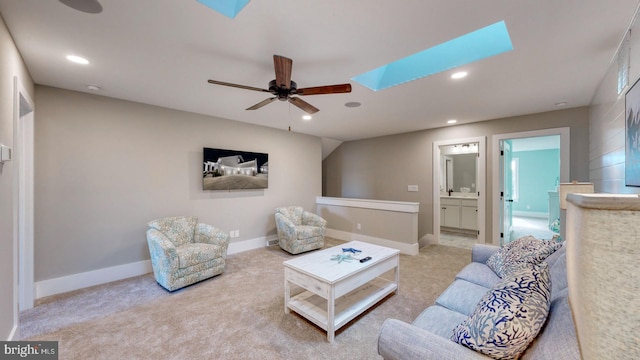 living room featuring light colored carpet and ceiling fan