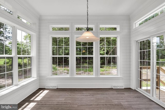 unfurnished sunroom with a wealth of natural light