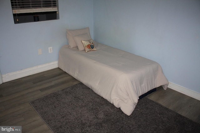 bedroom featuring dark wood-type flooring